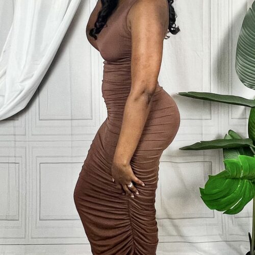 brown ruched maxi dress on a brown skin woman