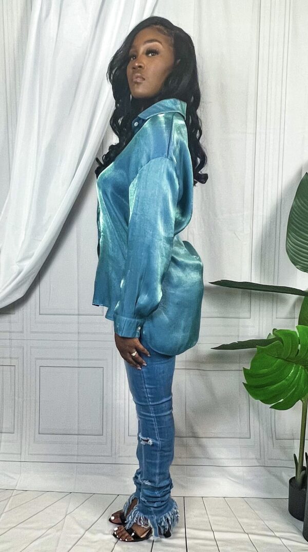 SilkBlueButtonDown_3 Woman wearing teal satin like long sleeve top with jeans