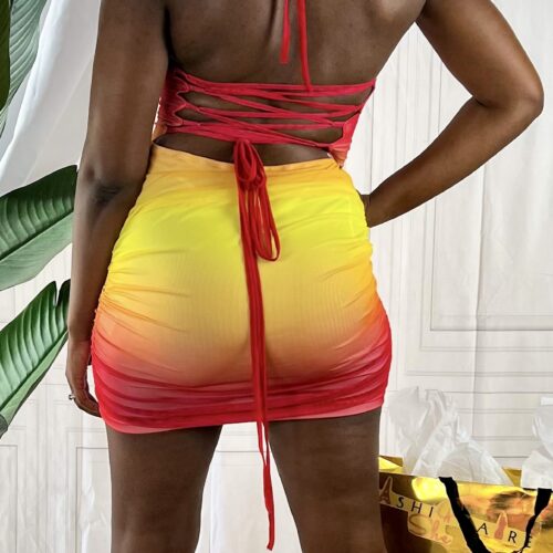 woman showcasing backside of a summer dress with tie up back