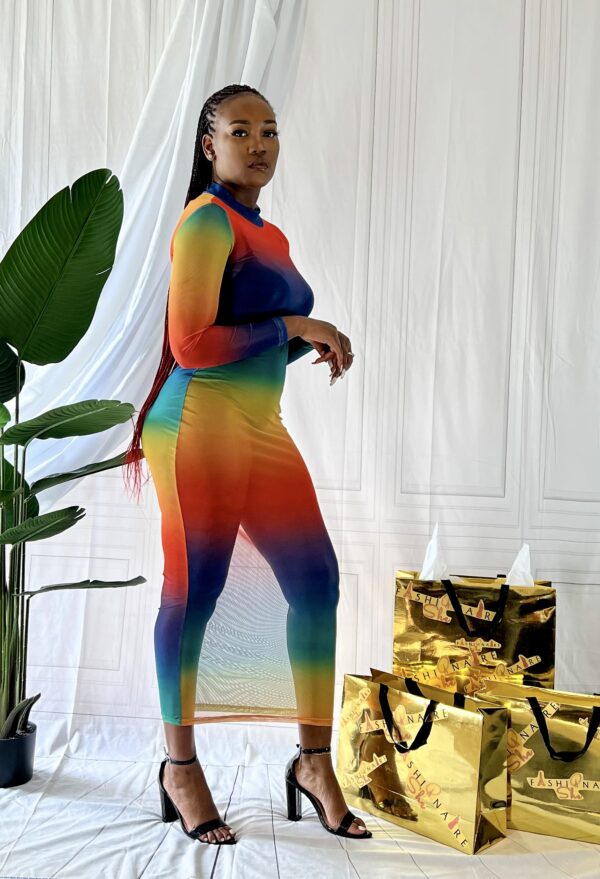 MeshMultiColor1 Woman modeling a rainbow colored mesh beach cover up